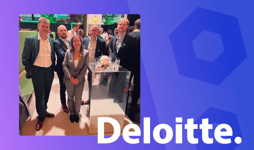 Azumuta team members networking at a Deloitte event, showcasing collaboration and innovation in a professional setting.