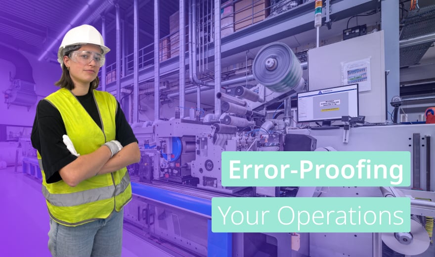A confident female factory worker wearing a safety helmet, goggles, and a high-visibility vest stands with arms crossed in front of industrial machinery. The background shows an automated production line with digital screens and mechanical rollers. A text overlay reads, “Error-Proofing Your Operations” in bold, light blue and white colors, highlighting a focus on improving manufacturing processes. The image has a professional, modern feel with a soft purple gradient effect on the left side.