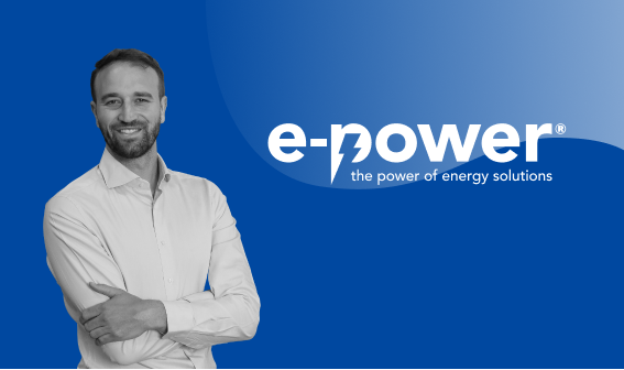 Jan Billen, Plant Manager at e-power, smiling with arms crossed, featured in black and white on a blue gradient background. The e-power logo and tagline “the power of energy solutions” appear prominently on the right side of the image.