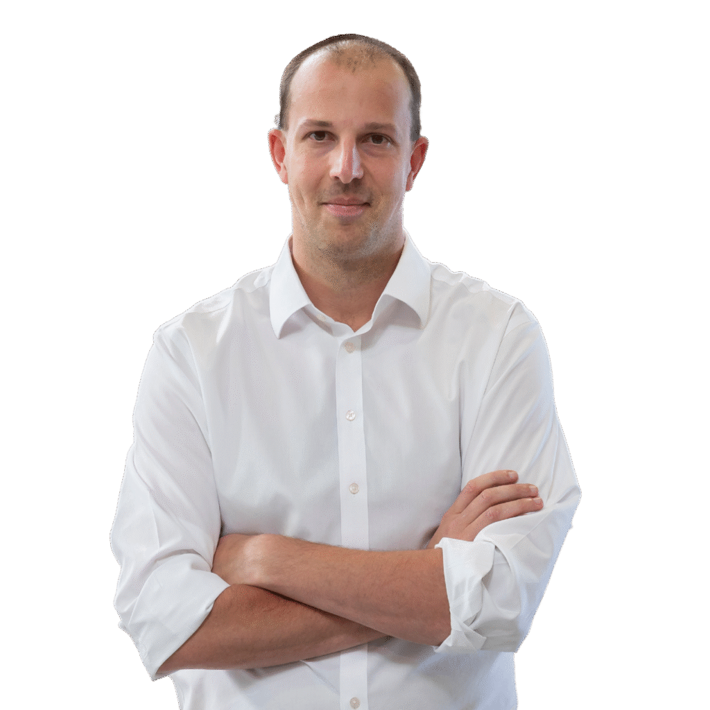 Robrecht Sollie, wearing a white button-up shirt and beige trousers, standing with arms crossed and a neutral expression. The background is transparent.